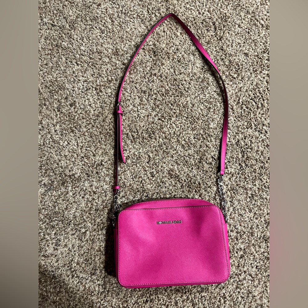 Hot pink over the shoulder Michael Kohrs bag
